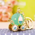 Adorable light green pumpkin carriage keychain charm with sparkling blue rhinestones - Jelly Pumpkin Carriage Blue