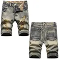 Men's vintage washed distressed denim shorts with ripped details and loose street style fit - EU 38 / Nostalgia Blue