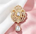 Detailed close-up of elegant gold-plated crown teardrop brooch with sparkling rhinestones - Crown Waterdrop Shape / Gold