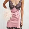 Detailed view of a sexy pink satin nightdress with delicate black lace accents - S / Pink