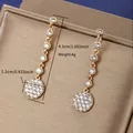 Elegant long gold drop earrings featuring tiered round crystals and a 4.3cm total length - Pink Marquise Floral (No. 4) / Gold