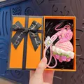 Delicate handmade pink and purple crochet flower bouquet keychain in a premium orange gift box - Creative Pink Rose (Orange Gift Box)