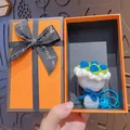 Handmade blue and white crochet flower bouquet keychain presented in an orange gift box - Blue Rose (Orange Gift Box)