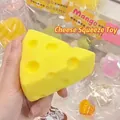 Detailed view of a yellow cheese shaped squishy toy for stress relief and sensory play - Triangle Cheese Squishy