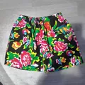 Detailed flat lay view of men's summer beach shorts featuring a vibrant floral print - 3XL / Bottoms / Black Floral Print (K06 Black)