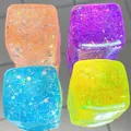 Set of four colorful aurora ice cube glitter squishy toys for effective stress relief - Sky Blue With Gold Glitter