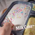Soft slow rebound cake-shaped slime toy with colorful sprinkles in a grey container - Milk Cake Box