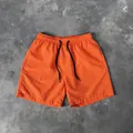 Short de plage décontracté pour homme orange vif avec taille à cordon réglable noir - M / Bottoms / Orange