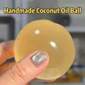 Soft and squishy stress relief ball toy in translucent yellow color - Coconut Oil