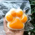 Soft slow-rebound cat paw squishy toy for stress relief in orange and white color - Rice Ball Cat Paw