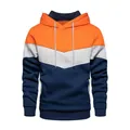 Detail view of a color-blocked orange, grey, and navy fleece pullover hoodie - S / Orange