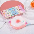 Simpatico giocattolo antistress a forma di ciambella rosa e bianca con decorazioni - Donut-Rosa