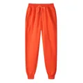 Vibrant orange fleece joggers with drawstring waist and ribbed ankle cuffs for men - S / Bottoms / Bright Orange