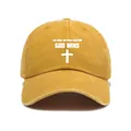 Close-up of mustard yellow washed denim baseball cap featuring God Wins cross print - One Size / Yellow