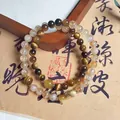 Elegant natural Tiger's Eye and Citrine beaded bracelet shown on a vintage background. - Double Wrap (6mm) / Yellow