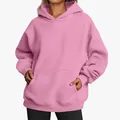 Detail view of the pink oversized women's hoodie featuring a spacious kangaroo pocket. - Pink
