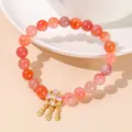 Bracelet vintage en perles d'aventurine rouge avec breloques fleur et plume dorées - 8mm / Style Attrape-rêves Agate Yanyuan