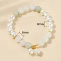 Elegant bracelet featuring 8mm white pearls and green jade beads with golden spacer charms - Ice Jade Artificial Pearl Stitching Style