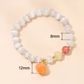 Elegant white cat eye stone bead bracelet with red aventurine and 12mm orange fruit charm - White Cat Eye Stone Peach Style