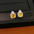 Eleganti orecchini a perno quadrati in zircone giallo con cornice di cristalli su base nera - Stud orecchini / Ago d'argento / Argento-Giallo