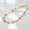 Detailed macro view of a colorful crystal candy bracelet featuring various gemstone shapes - Multicolor Geometric Cut Necklace (WG-1434) / Light gold