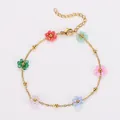 Bracelet bohème fait main avec fleurs en perles multicolores et chaîne en acier doré - Bracelet (Avec Perles) / Coloré
