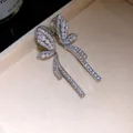 Close-up of 18k gold plated butterfly ear clips with pearls and cubic zirconia - Butterfly Style (HE34292) / Silver