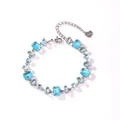 Elegant stainless steel bracelet featuring light blue multi-faceted aquamarine zircons - Square and Rectangular Aquamarine Zirconia (Style 2)