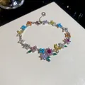 Detailed view of 18k gold plated bracelet with colorful zircons and pearl flowers - Bracelet / Silver - Rainbow
