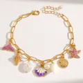 Gold ocean-themed charm bracelet featuring starfish, mermaid tail, shells, and pearls - Purple Style (DZ-330) / Purple