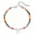 Detailed close-up of a 4mm African turquoise beaded bracelet with a silver bow charm - African Turquoise Color