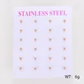 Close-up of twelve pairs of minimalist golden stainless steel ball stud earrings on a card - 2mm (ai-12 Pairs/Pack) / Gold