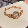 Luxury rose gold ladies' bracelet watch with sparkling rhinestone floral design - Gold
