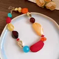 Detailed view of colorful acrylic geometric beads necklace on a white plate - 69# Necklace / Colorful