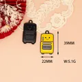 Detailed view of vintage luggage enamel pendants with 39mm x 22mm dimensions - Steaming Oven (G)