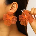 Oversized orange hollow flower earrings with layered petals for a bold statement look. - Earrings (5188) / Orange