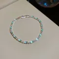 Eleganter silberfarbener Armreif mit hellblauen Kristallperlen und funkelnden Zirkonia - Rechteckiger Kristall Eleganter Stil (56#)