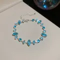 Elegante bracciale in argento con cristalli blu taglio marquise e catena regolabile - Argento-Celeste