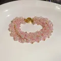 Detailed view of handmade pink glass bead and pearl bracelet with gold clasp - 78# Bracelet / Gold-Pink