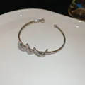 Elegante bracciale a serpente argento con occhio verde e pavé di zirconi brillanti - Stile Serpentino con Pavé di Zirconia (54#) / 1 Pezzo / Argento