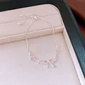 Elegant silver bow bracelet with pink zircon hearts in jewelry box details. - Bow Style / Silver Pink