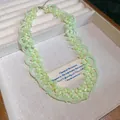 Detailed view of light green beaded flower necklace in a premium jewelry display box - Necklace (HN11516) / Green