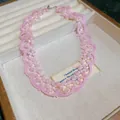 Detailed shot of pink beaded lace-style choker with cat-eye stones in a jewelry box - Clavicle Necklace (HN11516) / Pink