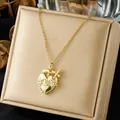 Close-up of gold-plated stainless steel Gothic heart pendant necklace with sword and roses - Gothic Heart Rose Sword Pendant Style (N4478) / Gold