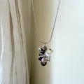 Detailed view of a grape-shaped pendant necklace with colorful stones and silver metal. - Pink Rose Cluster Necklace