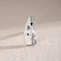Detailed view of abstract human face mask earring with polished silver metallic finish - Polished Face Mask Ring / Silver
