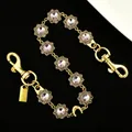 Detail of luxury gold metal bag chain with sparkling rhinestones and flower links - Luxury Floral Style (2473) / Gold