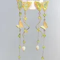 Detailed view of long gold butterfly dangle earrings with green stones and pearl drops - 2# Long Tassel / Silver / Gold-Yellow