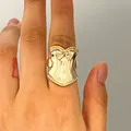 Detailed view of a gold corset-shaped ring worn on a finger for a vintage fashion look. - Corset Style(A-1213) / Gold