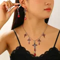 Detailed shot of Gothic cross jewelry set featuring red enamel and gemstone accents. - Antique Silver Cross Style (H-235)